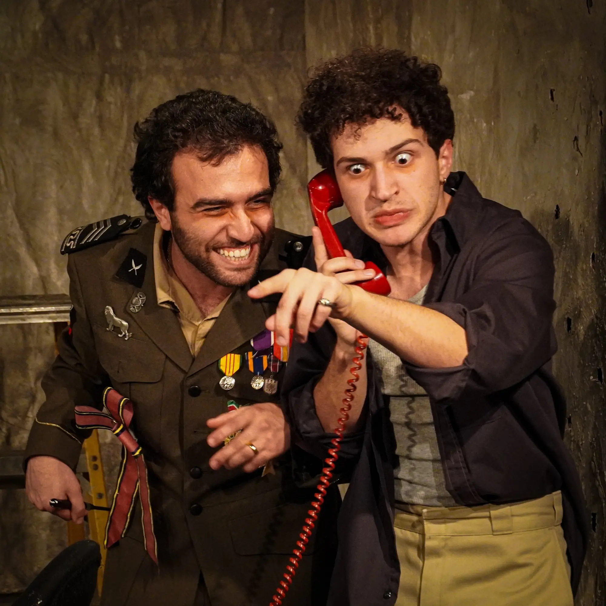 The pair listen together on the telephone