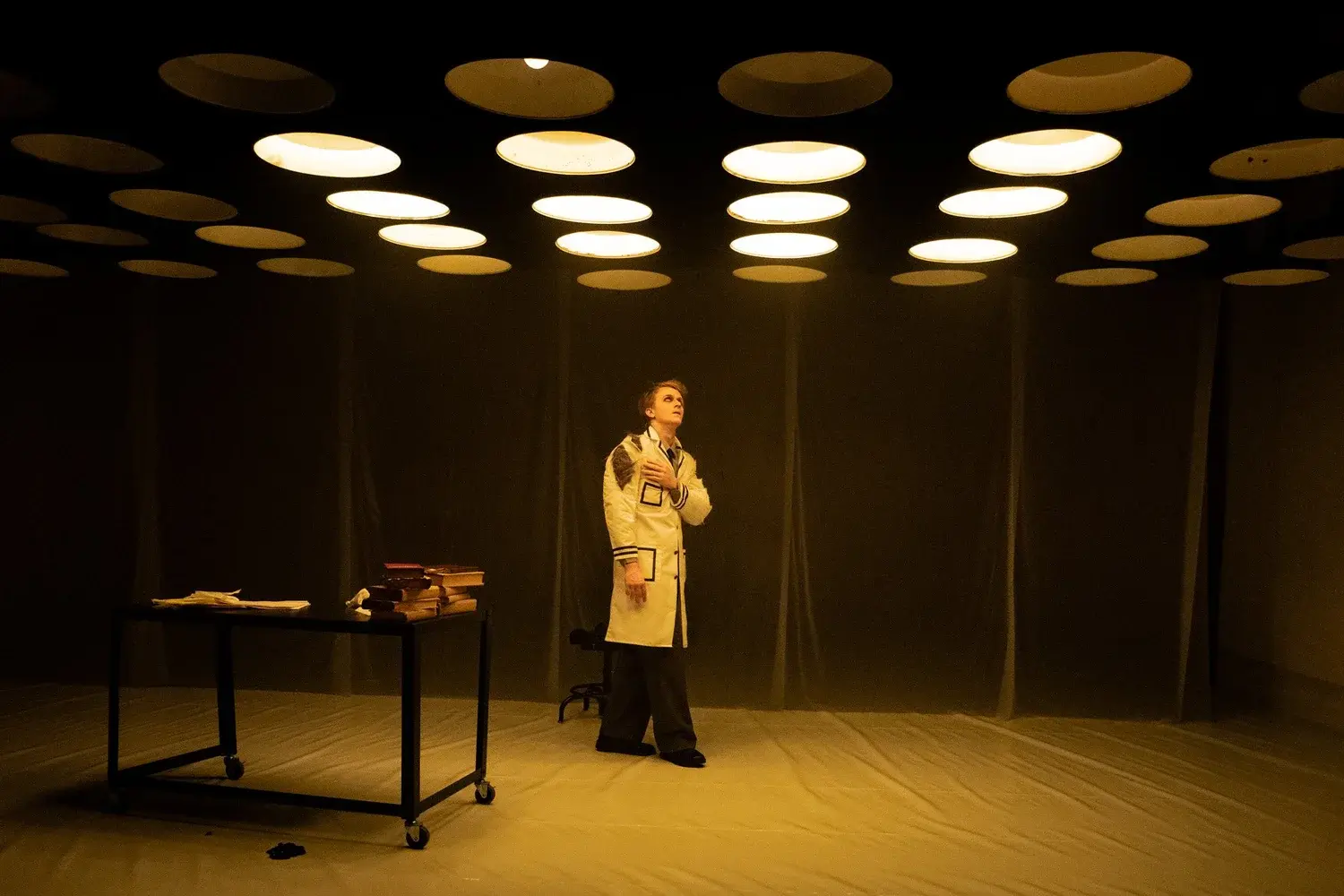 Two scientists argue across a laboratory table
